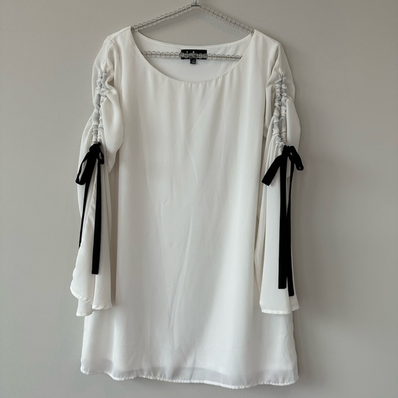 Lulu’s Cherish White Long Sleeve Shift Dress With Black Bow Detail. - Picture 6 of 9